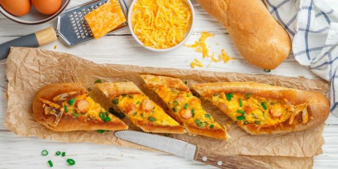 Baguette baked with eggs and sausages