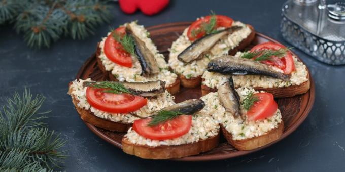 Sandwiches with sprats, tomatoes and crab sticks