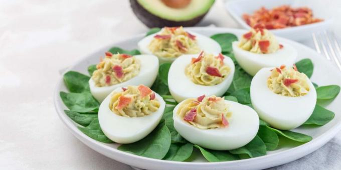 Stuffed eggs with avocado cream and bacon