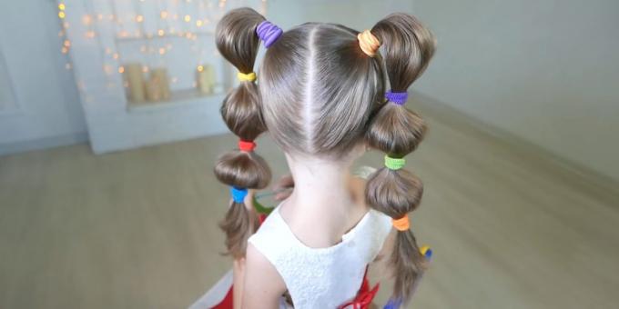Hairstyles for girls: bulky tails with rubber bands