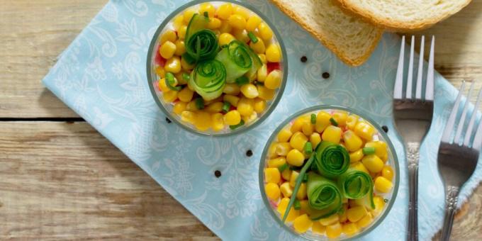 Layered salad with crab sticks, rice and corn