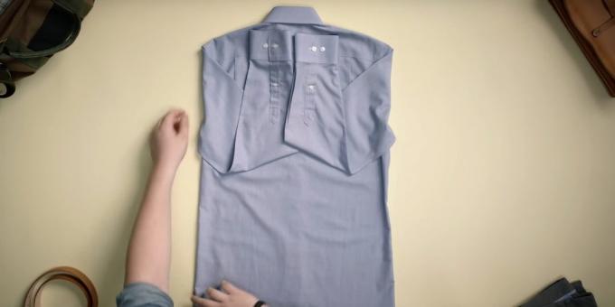 How to fold a shirt: bend the arm upwards