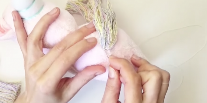 How to make a stuffed toy: sew on a tail