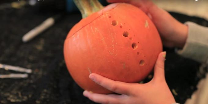 Crafts from pumpkin: make a hole with a thick drill