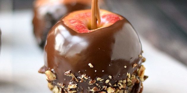 Caramel apple with chocolate and nuts