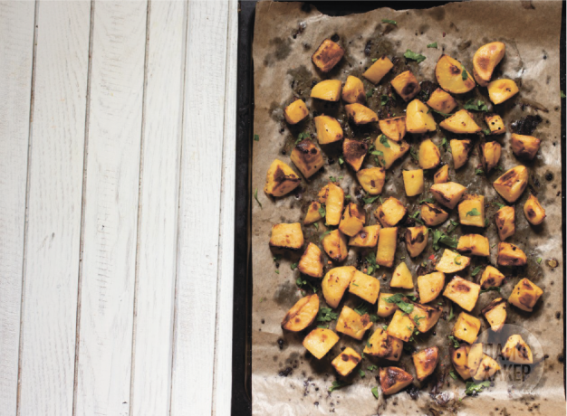 Baked potato with mustard and lemon peel in the oven