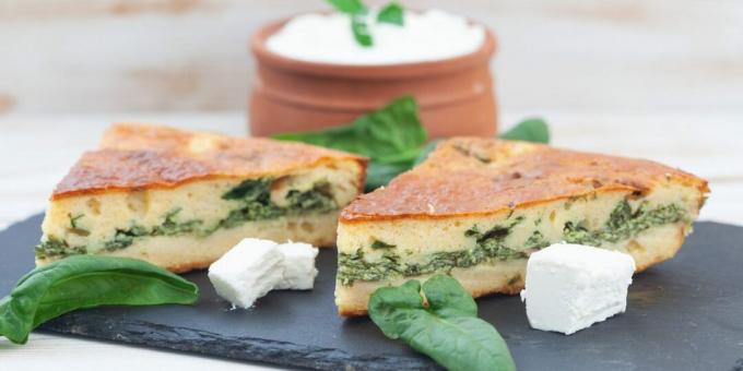 Jellied pie with spinach in a pan