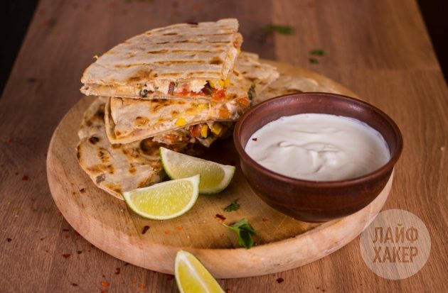 Quesadillas with chicken, corn and tomato salsa served with sour cream or guacamole sauce