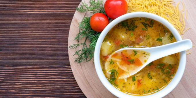 Chicken soup with noodles and tomatoes