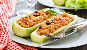 Zucchini stuffed with millet, tomatoes and olives
