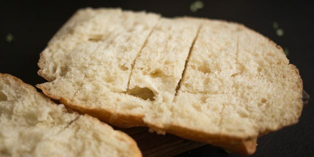 How to Make Garlic Cheese Croutons: Halve a Loaf