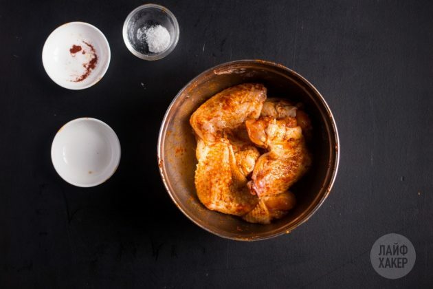 Combine salt, paprika and baking powder, then pour over the chicken wings
