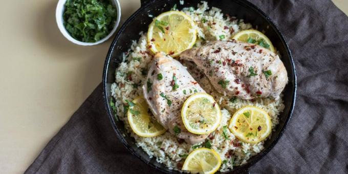 Lemon rice with chicken and herbs in a pan