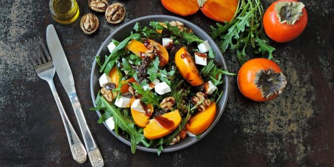 Salad with persimmon, cheese and tangerines