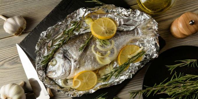 Dorado baked in foil with onion and lemon