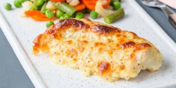 Fish baked with cheese and mayonnaise in the oven