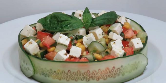 Salad of cucumbers, tomatoes and feta cheese and corn with soy sauce