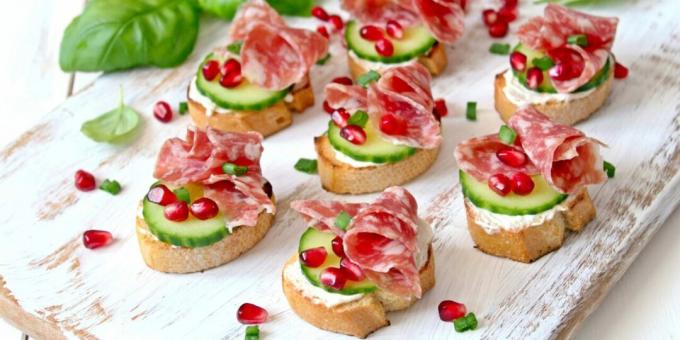Sandwiches with sausage, cheese and pomegranate