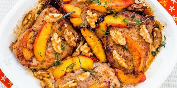 Recipe of pork in a frying pan with peaches and walnuts