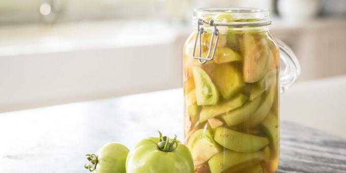 Pickled green tomatoes for the winter with apples and beets