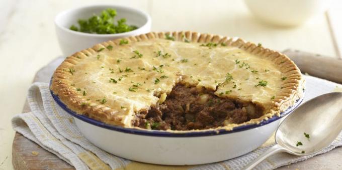 Pie with meat and potatoes in the oven