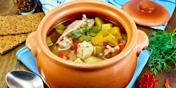 Chicken with potatoes, cabbage and peppers in pots