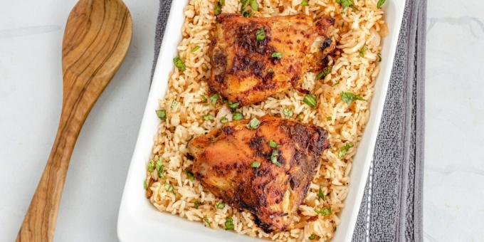 Chicken thighs baked with rice in the oven