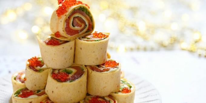 Pancake rolls with red fish and caviar