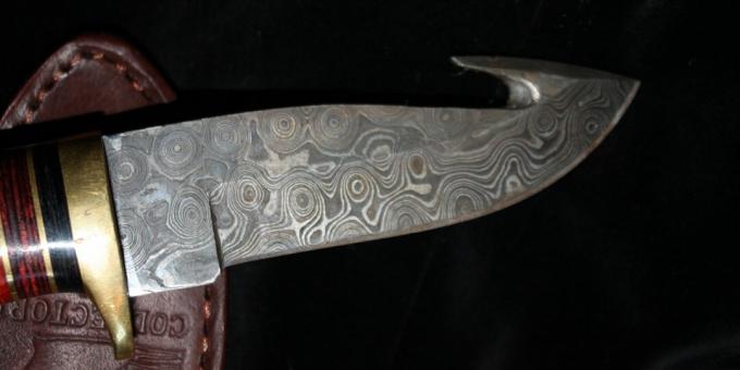 Ancient civilization technologies: modern hunting knife made of Damascus steel 