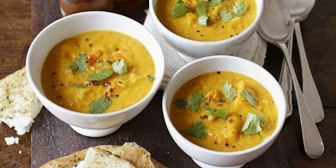 Spicy pumpkin soup with lentils and coconut milk