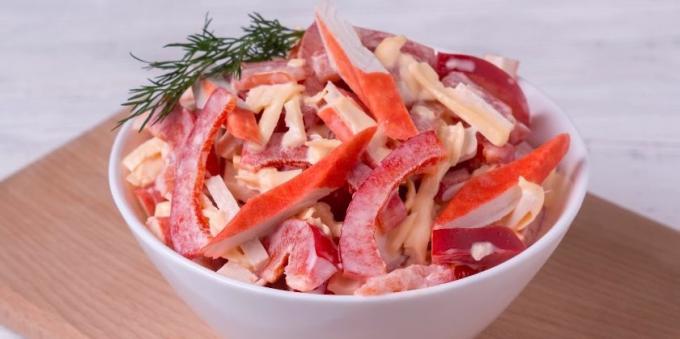 Salad with crab sticks, tomato, cheese and pepper