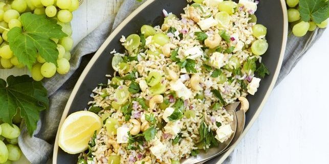Salad with rice, grapes, nuts and feta