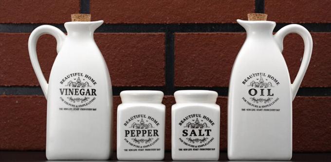 A set of containers for oil, vinegar, salt and pepper