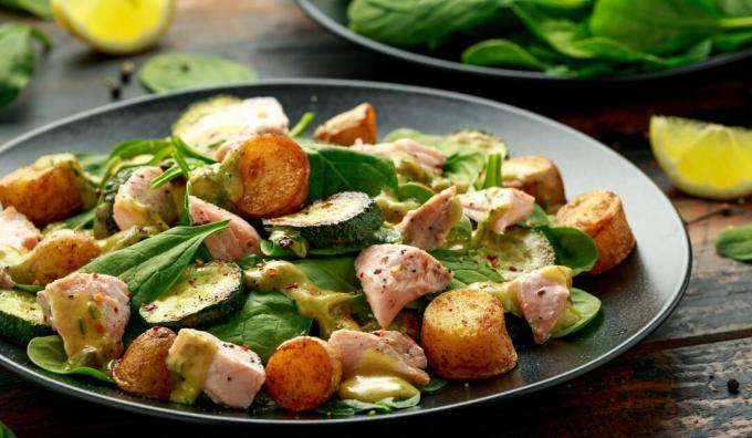 Warm salad with zucchini, young potatoes and fish