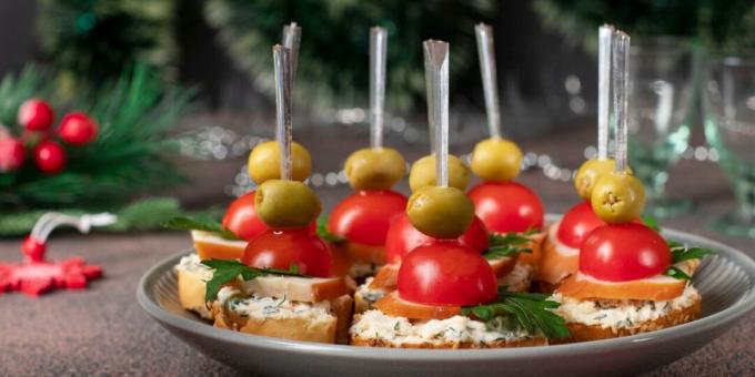 Canape with smoked chicken, cherry tomatoes and olives