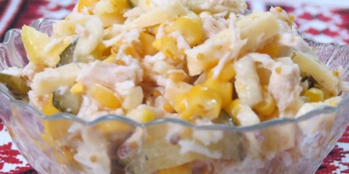 Salad with apple, chicken, cheese, cucumbers, corn and mustard dressing