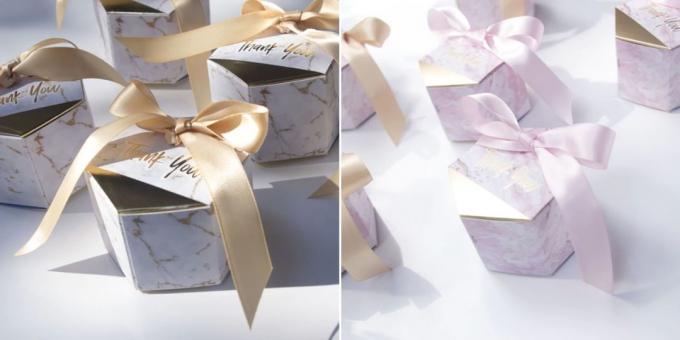 Gift Packaging: box with ribbons