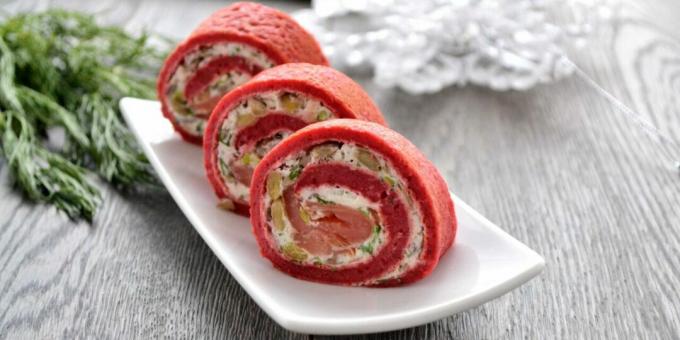 Pancake rolls with red fish, mushrooms and cheese