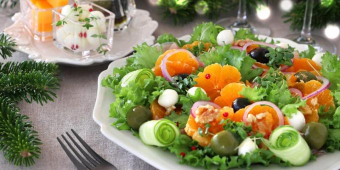 Light festive salad with tangerines, olives and cheese
