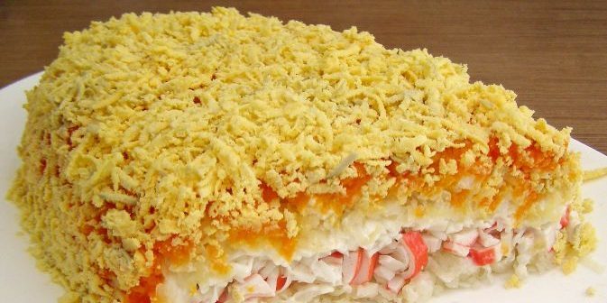 Puff salad of boiled carrots, crab sticks, potatoes and eggs
