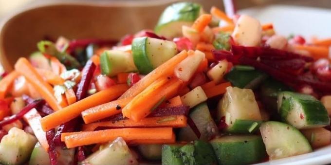 Salad of fresh beets with cucumber, carrot, pomegranate and mango