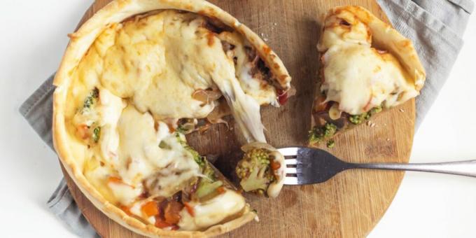 Upside down pizza with mushrooms, cheese and broccoli