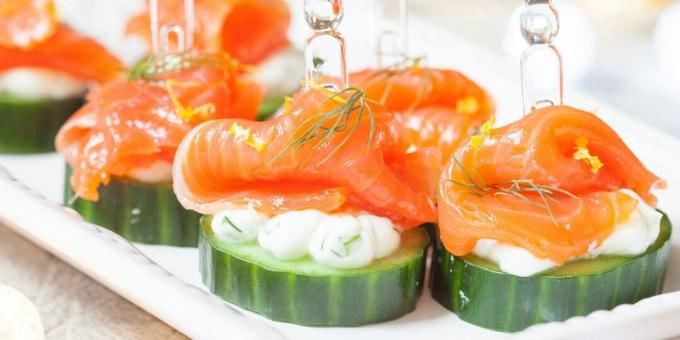 Canapes with red fish on cucumbers