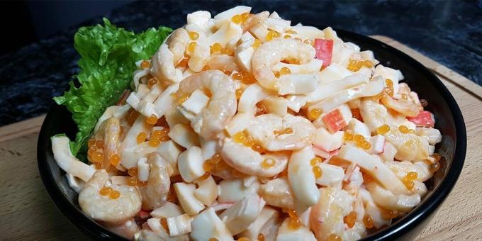 Salad with shrimps, squid, crab sticks and red caviar