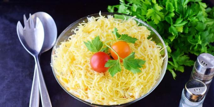 Layered salad with chicken, eggs and cheese