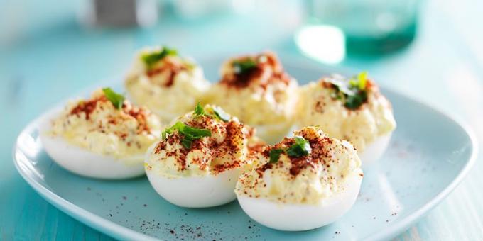 Stuffed eggs with mashed potatoes and gherkins
