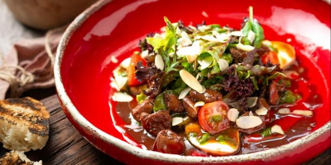 Warm salad with beef liver and almond petals