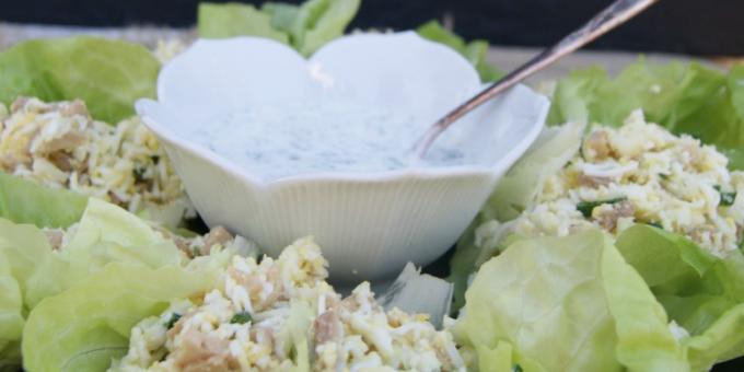 Salad with cod liver with rice or cauliflower and yoghurt sauce