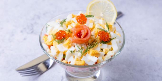 Layered salad with red fish and cheese