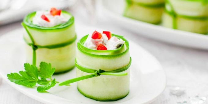 Cucumber rolls with cheese, olives and peppers